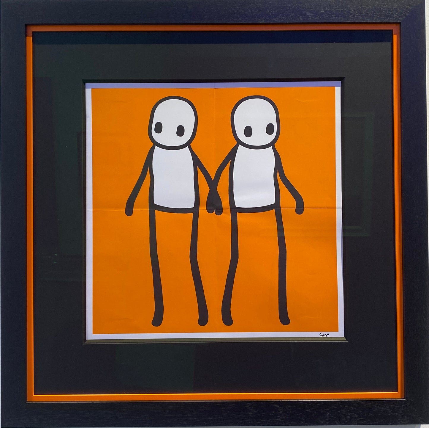 Signed holding hands (Orange) by Stik